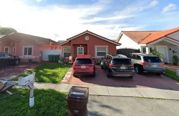 a car parked in front of a house