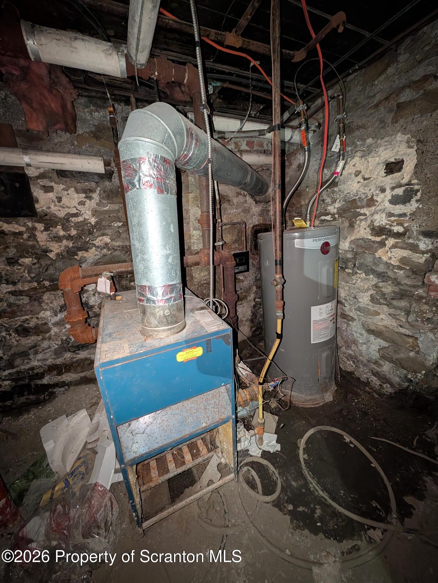 123 South Bromley Avenue Scranton, PA 18504 - Photo 14 of 15 a room with water heater and wooden racks
