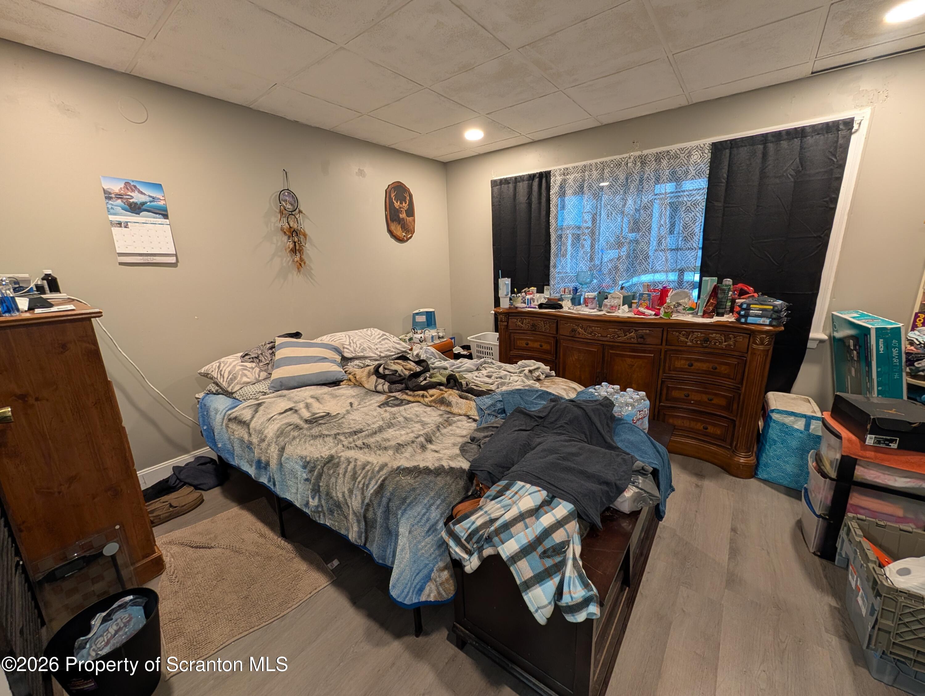 123 South Bromley Avenue Scranton, PA 18504 - Photo 5 of 15 a bedroom with a bed and a flat screen tv