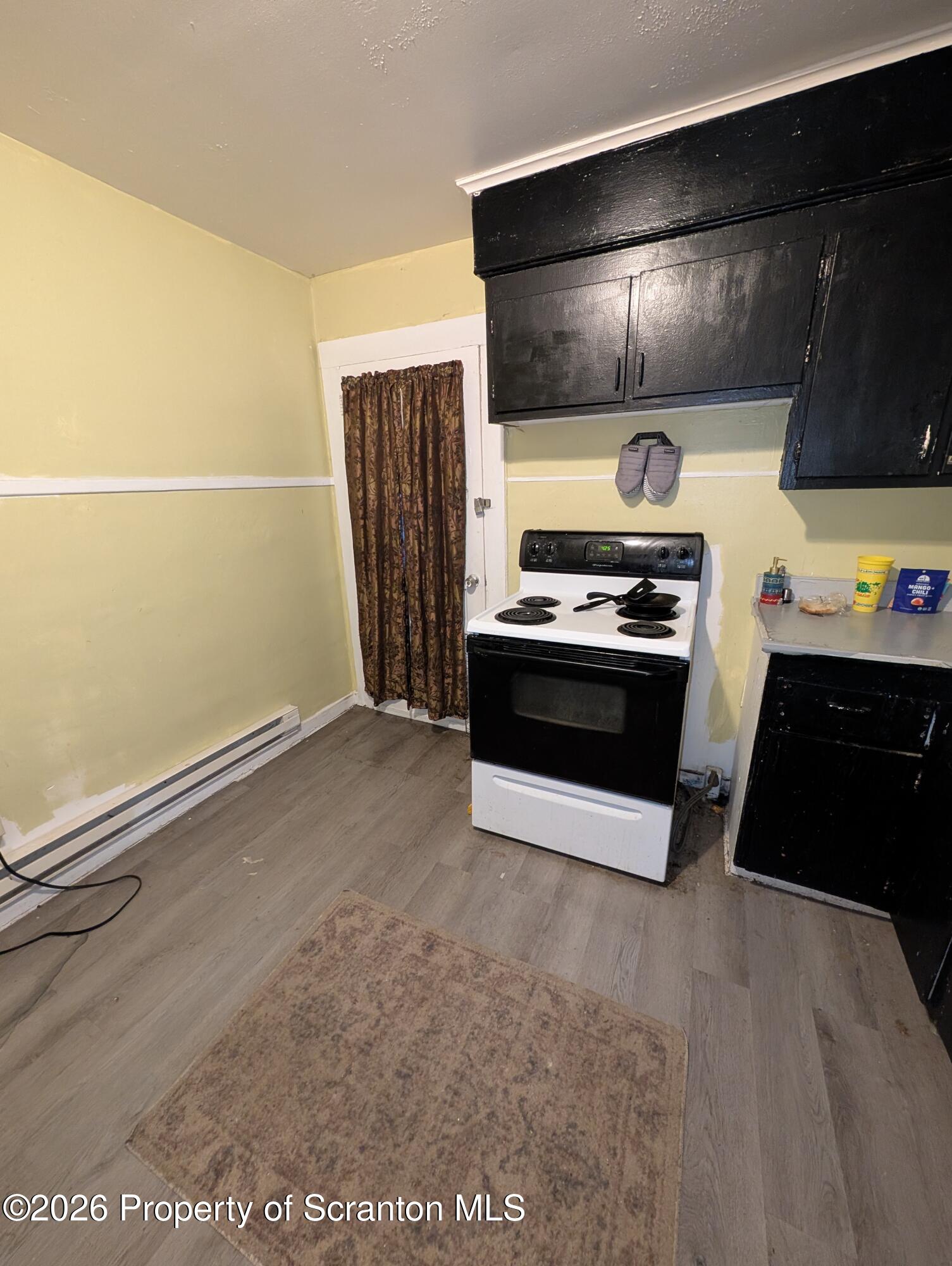 123 South Bromley Avenue Scranton, PA 18504 - Photo 8 of 15 a kitchen with refrigerator and cabinets
