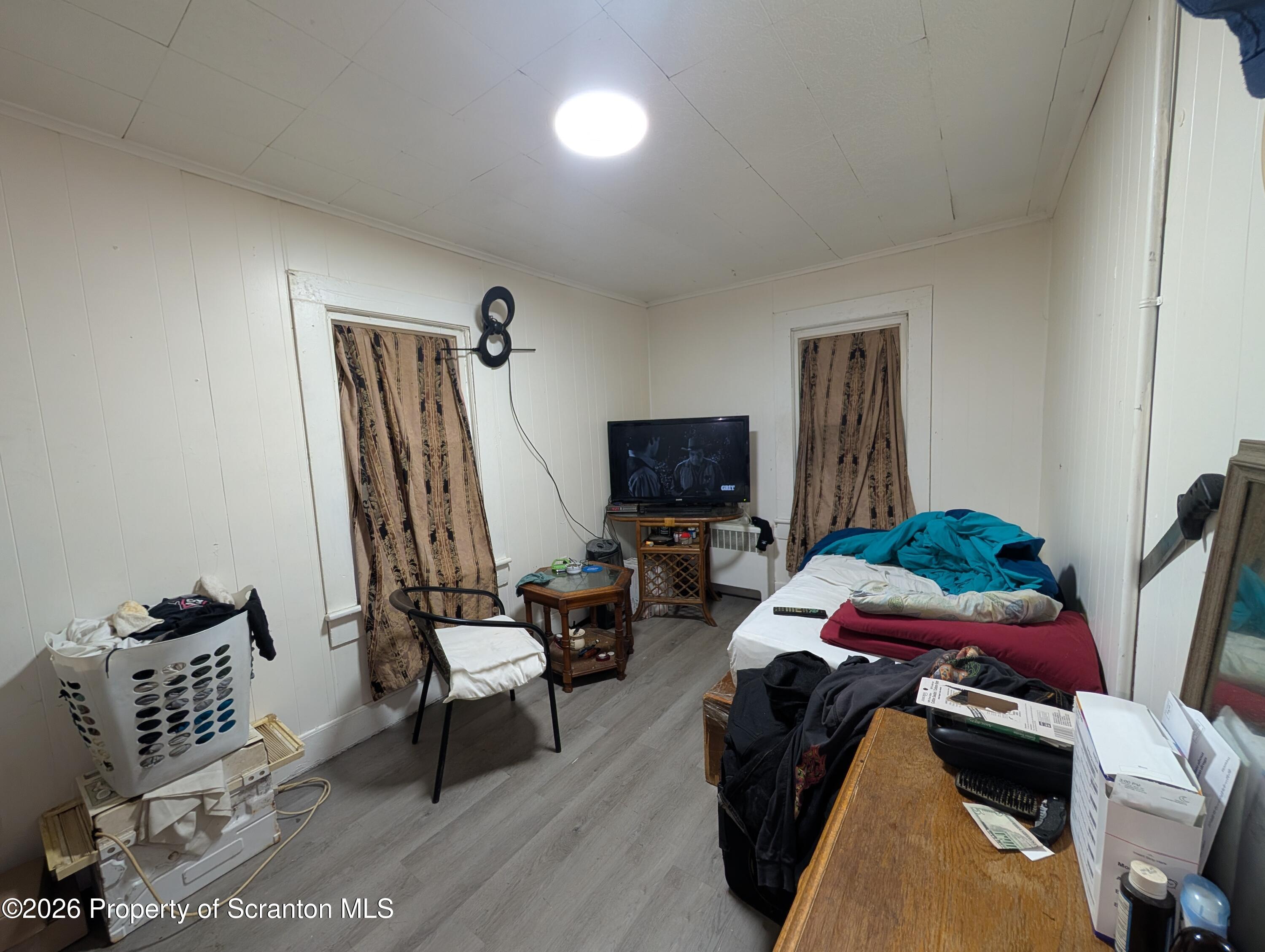 123 South Bromley Avenue Scranton, PA 18504 - Photo 9 of 15 a bedroom with furniture and a flat screen tv