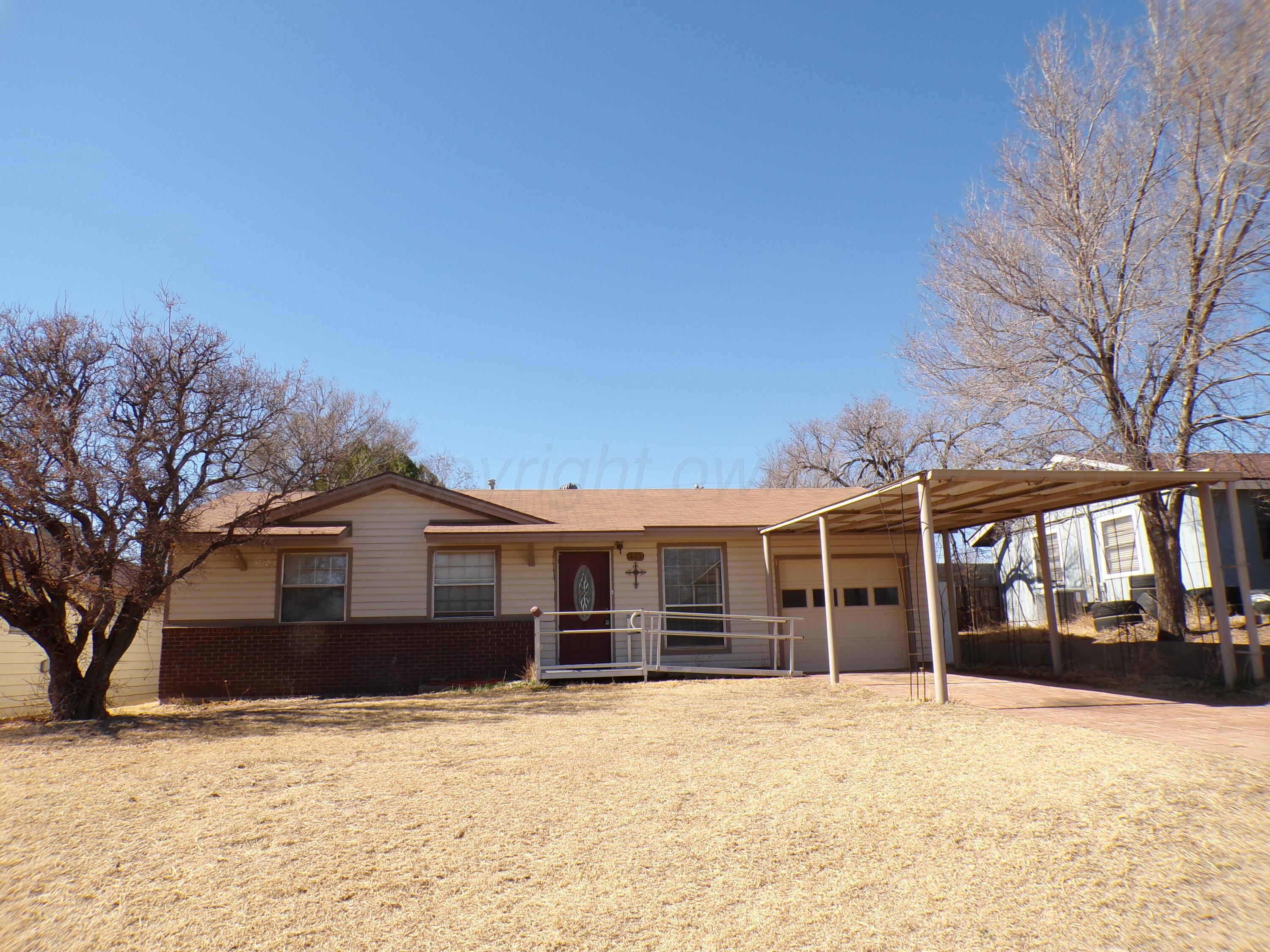 403 North Robey Avenue Fritch, TX 79036 - Photo 1 of 24 a view of a house with a yard covered in snow