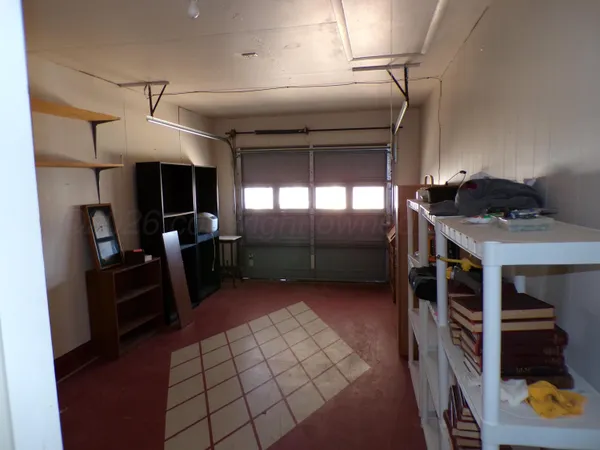 a kitchen with refrigerator and window