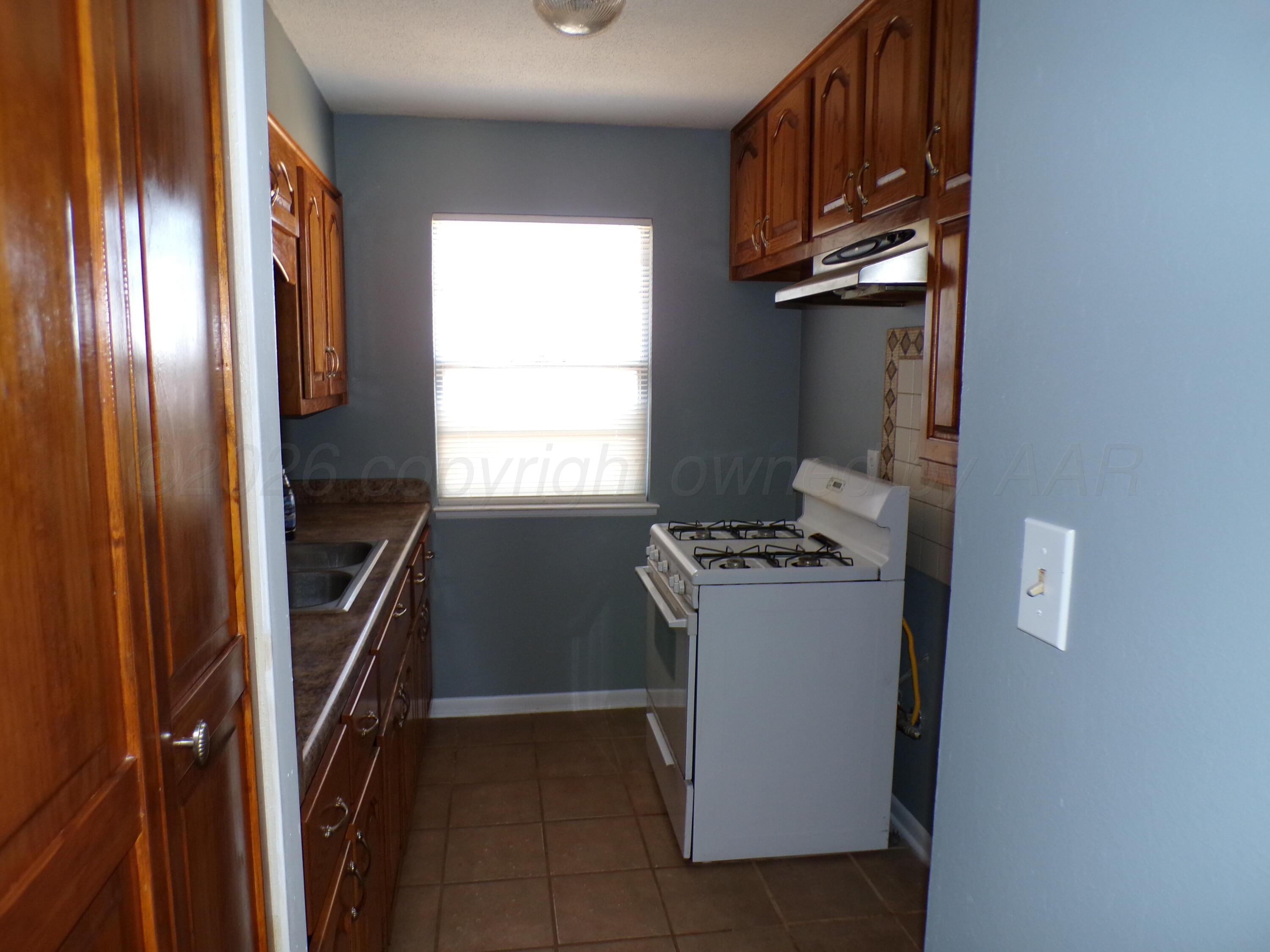403 North Robey Avenue Fritch, TX 79036 - Photo 10 of 24 a view of an empty room with a window