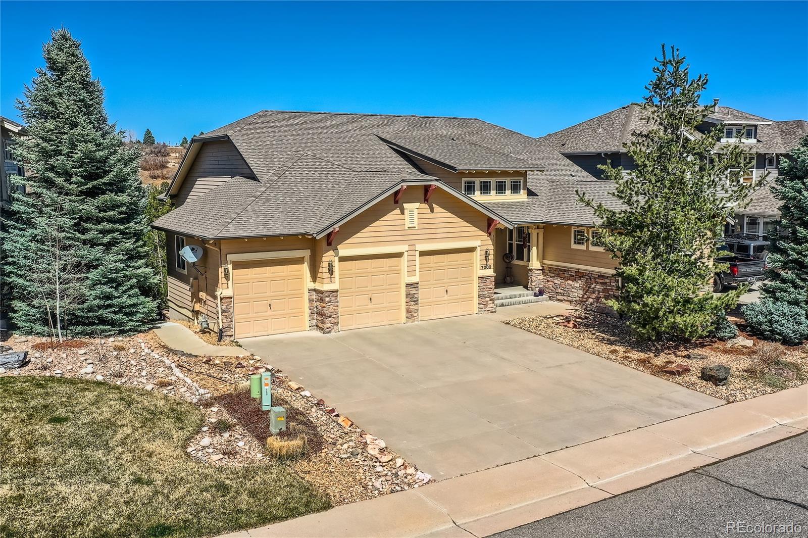 a view of a house with a snow in the background