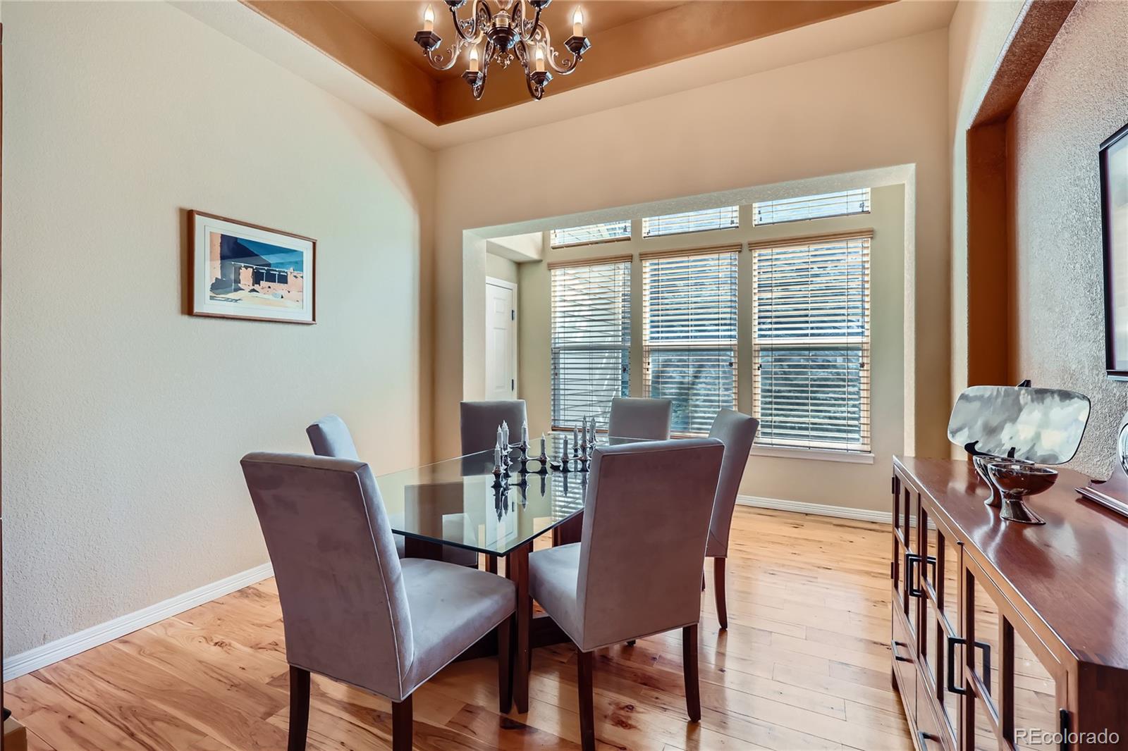 7009 Winter Ridge Place Castle Pines, CO 80108 - Photo 13 of 42 a view of a dining room with furniture window and outside view