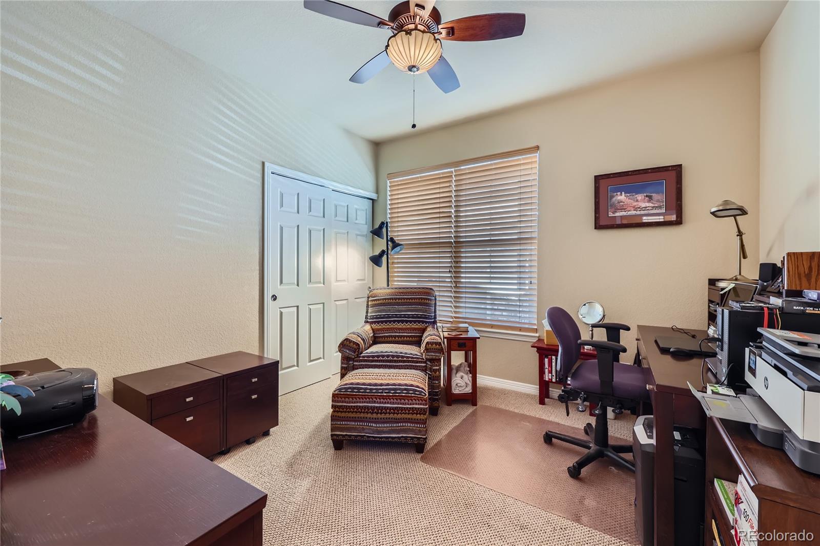 7009 Winter Ridge Place Castle Pines, CO 80108 - Photo 21 of 42 a living room with furniture and a window