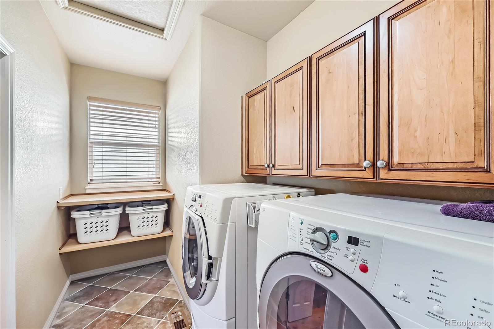 7009 Winter Ridge Place Castle Pines, CO 80108 - Photo 24 of 42 a utility room with dryer and washer