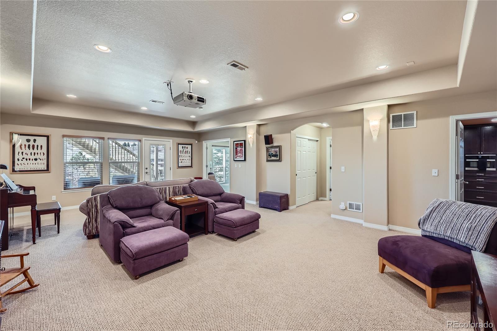 7009 Winter Ridge Place Castle Pines, CO 80108 - Photo 27 of 42 a living room with furniture and a large window