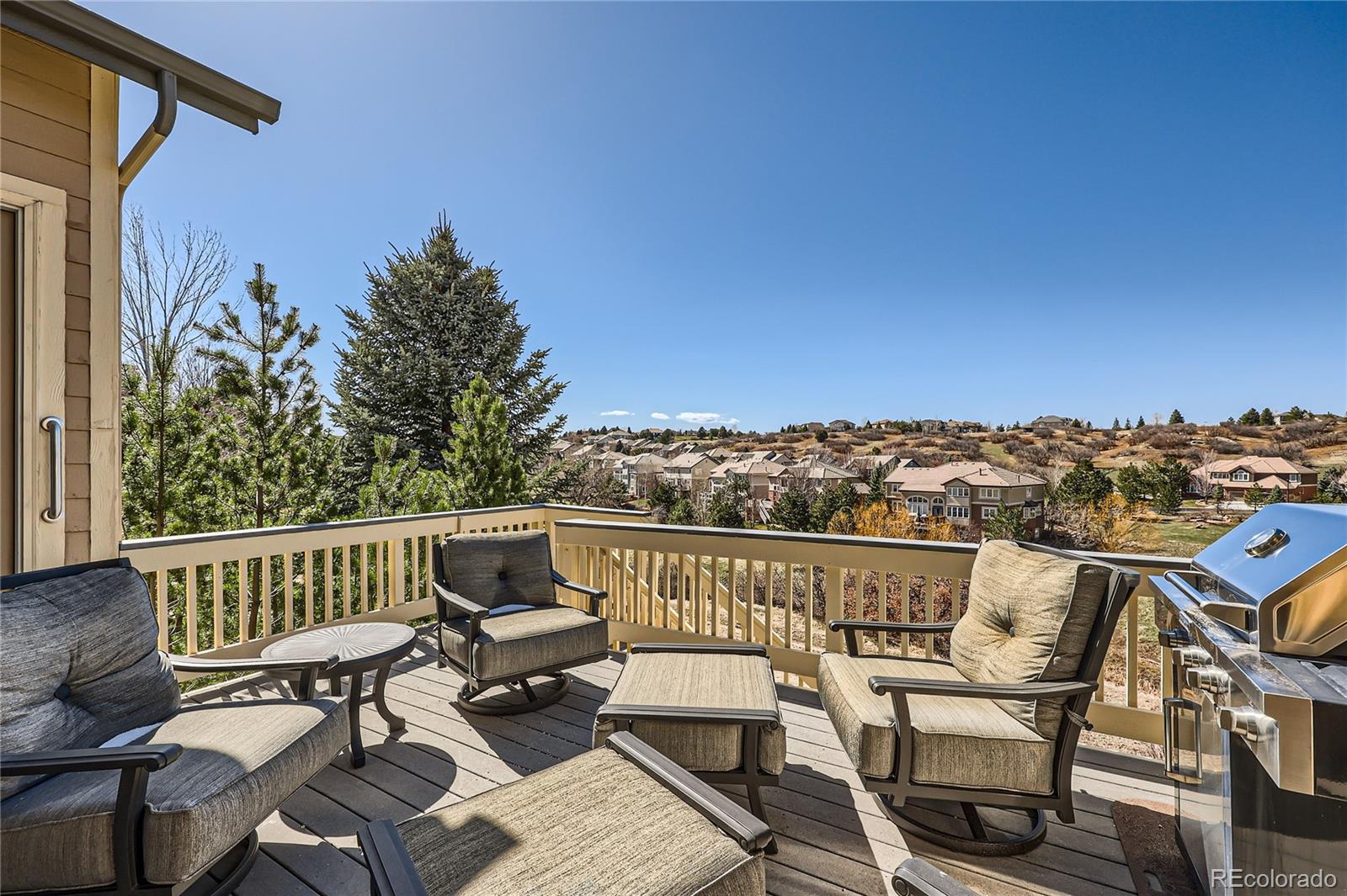 7009 Winter Ridge Place Castle Pines, CO 80108 - Photo 3 of 42 a view of a chairs and table on the terrace