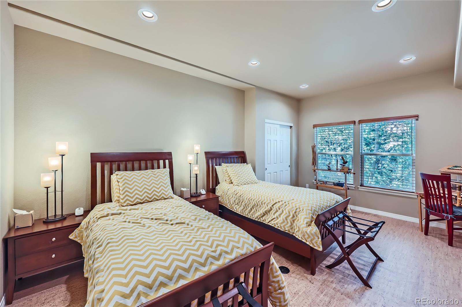 7009 Winter Ridge Place Castle Pines, CO 80108 - Photo 34 of 42 a bedroom with two beds and a large window