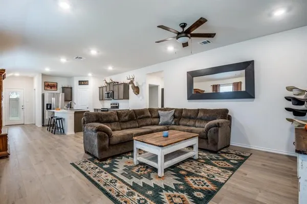 a view of a house with a yard and porch