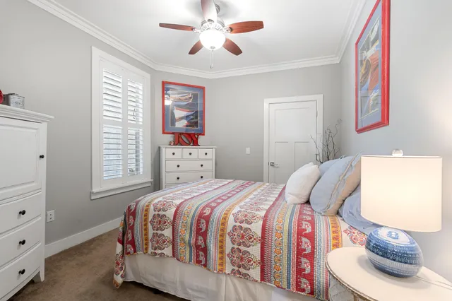 a bathroom with a granite countertop toilet and a sink
