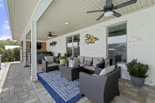 swimming pool view with a seating space