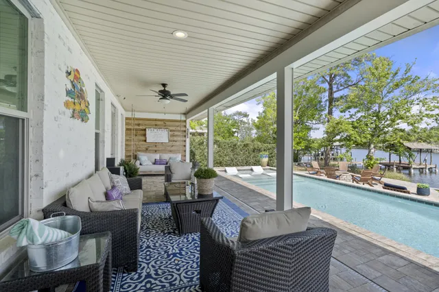 a view of a swimming pool with a lounge chairs