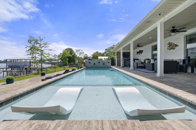 an aerial view of a houses with city view