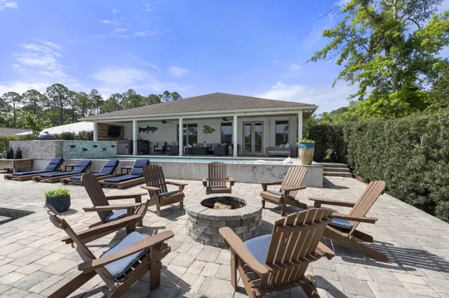 a view of a lake with boats and trees in the background