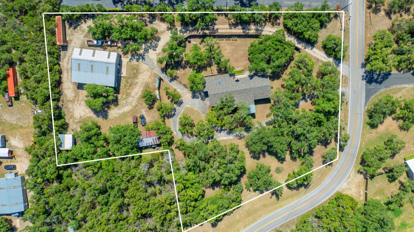 an aerial view of house with yard