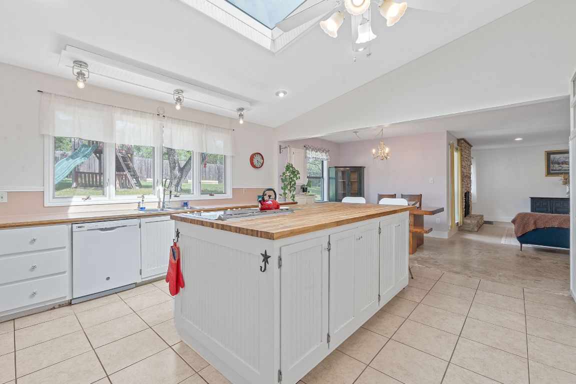 8705 South View Road Austin, TX 78737 - Photo 10 of 39 a large white kitchen with a large window