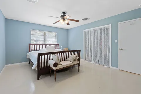 a bedroom with furniture and a window