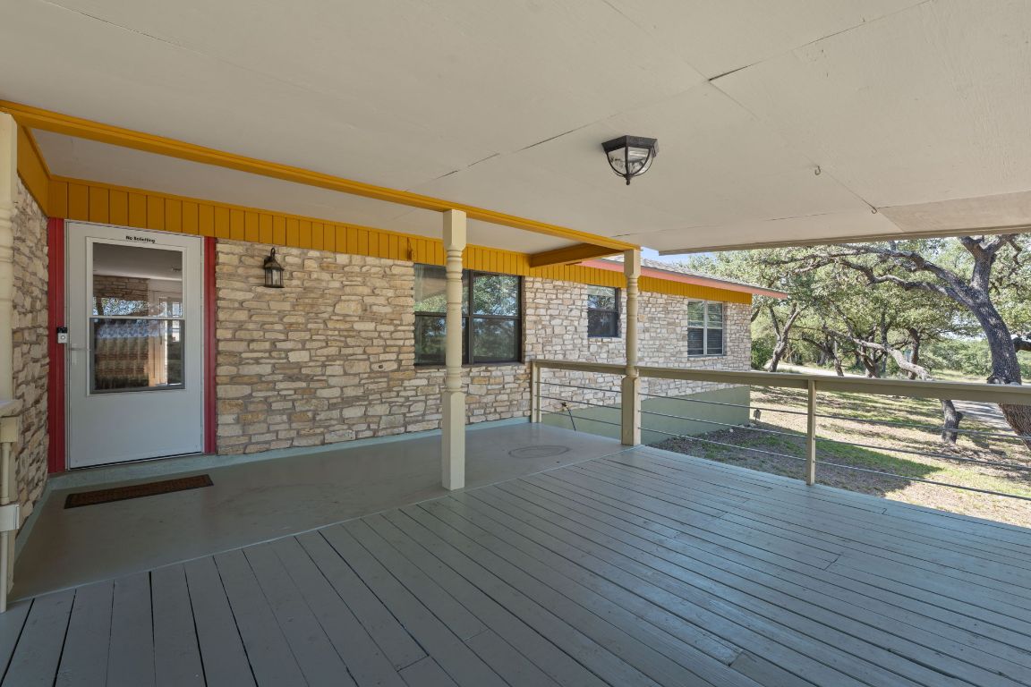 8705 South View Road Austin, TX 78737 - Photo 26 of 39 a view of outdoor space with wooden floor and seating