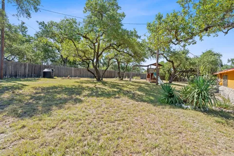 a view of a backyard with trees