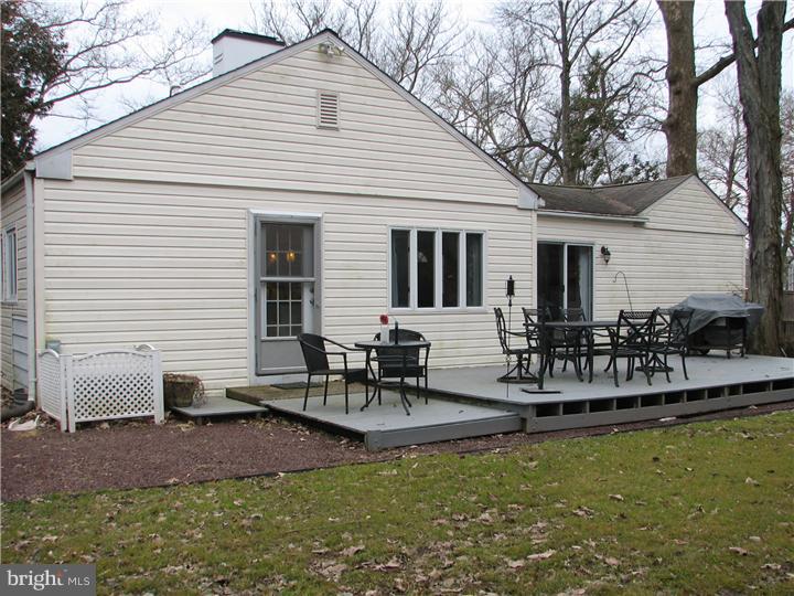 70 Valley Road Princeton, NJ 08540 - Photo 18 of 22 a view of a patio with table and chairs potted plants and large tree