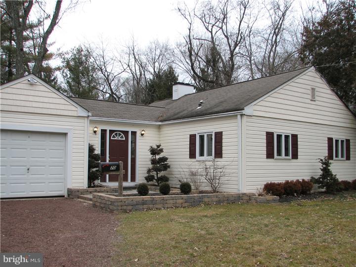 70 Valley Road Princeton, NJ 08540 - Photo 4 of 22 a view of a house with a yard and garage