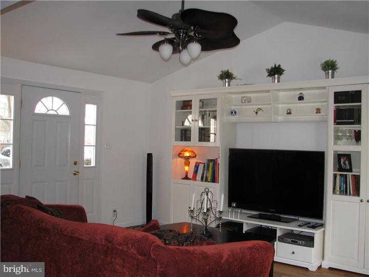70 Valley Road Princeton, NJ 08540 - Photo 5 of 22 a living room with furniture a flat screen tv and a fireplace
