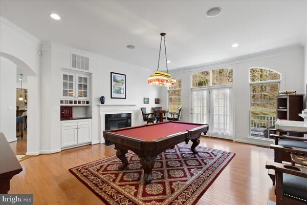 a bedroom with a large bed and a flat screen tv