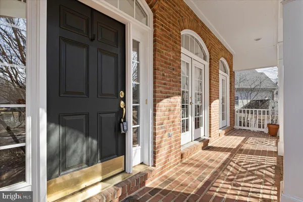 a living room with furniture and large window