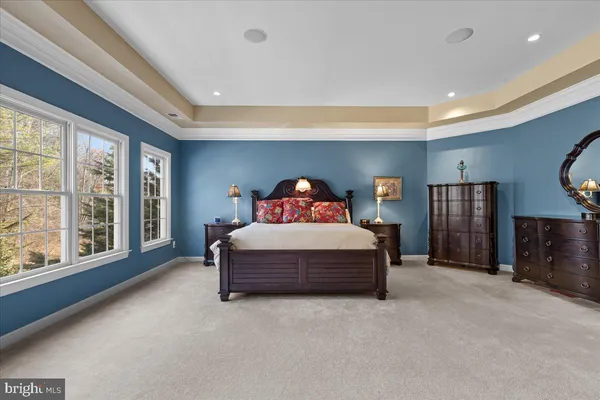 a bedroom with a bed and a lamp