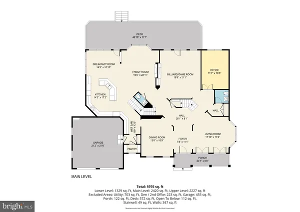 a living room with furniture and floor to ceiling windows