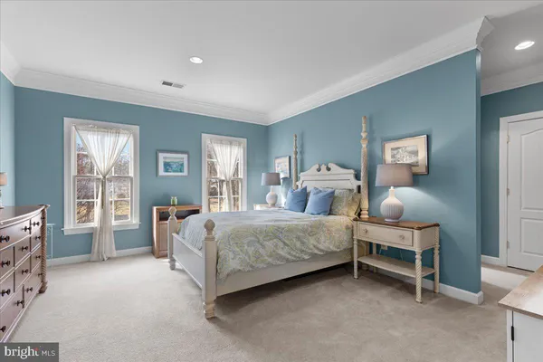 a bathroom with a sink a toilet a shower curtain and a bath tub