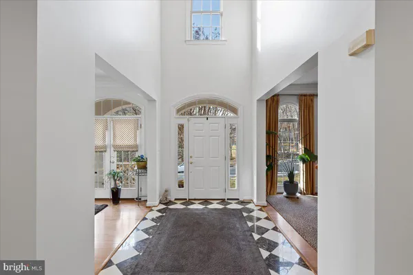 a dining room with furniture a livingroom and chandelier