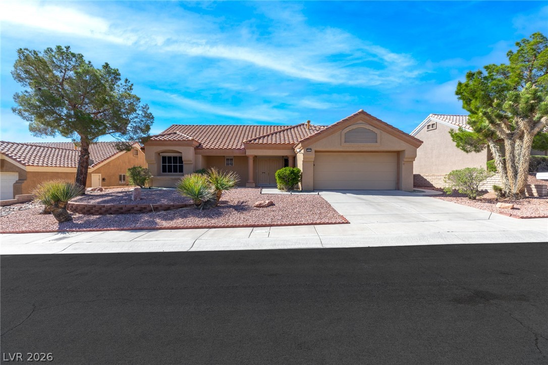 This charming residence features a well-maintained exterior and inviting curb appeal.