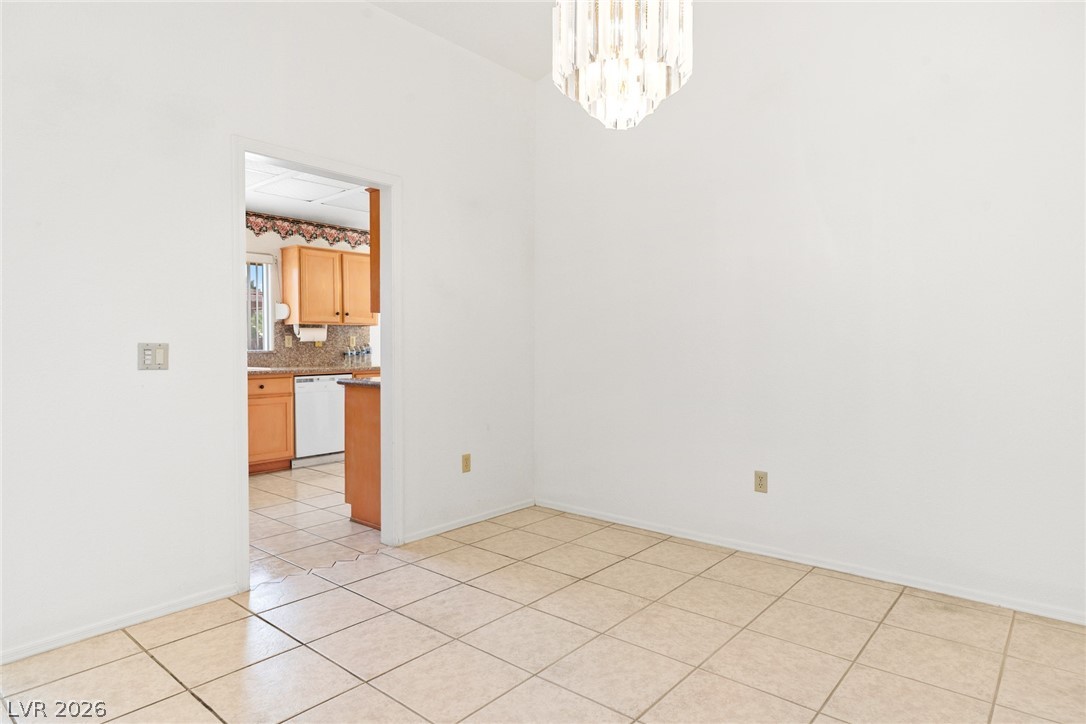 9433 Quail Ridge Drive Las Vegas, NV 89134 - Photo 11 of 25 This bright space offers versatile living, with an adjacent kitchen for effortless entertaining.