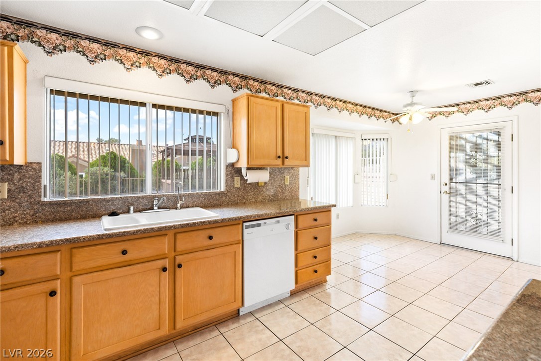 9433 Quail Ridge Drive Las Vegas, NV 89134 - Photo 13 of 25 This spacious kitchen offers ample cabinetry, durable countertops, and abundant natural light.