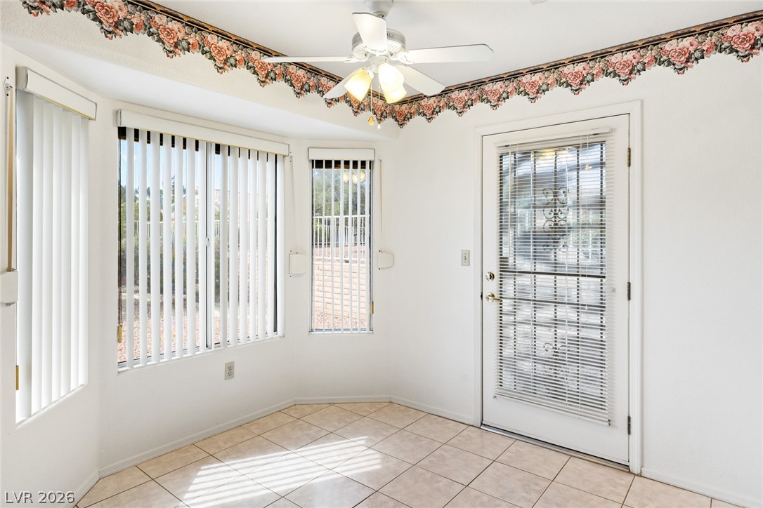 9433 Quail Ridge Drive Las Vegas, NV 89134 - Photo 14 of 25 Bright sunroom with ample windows and direct outdoor access.