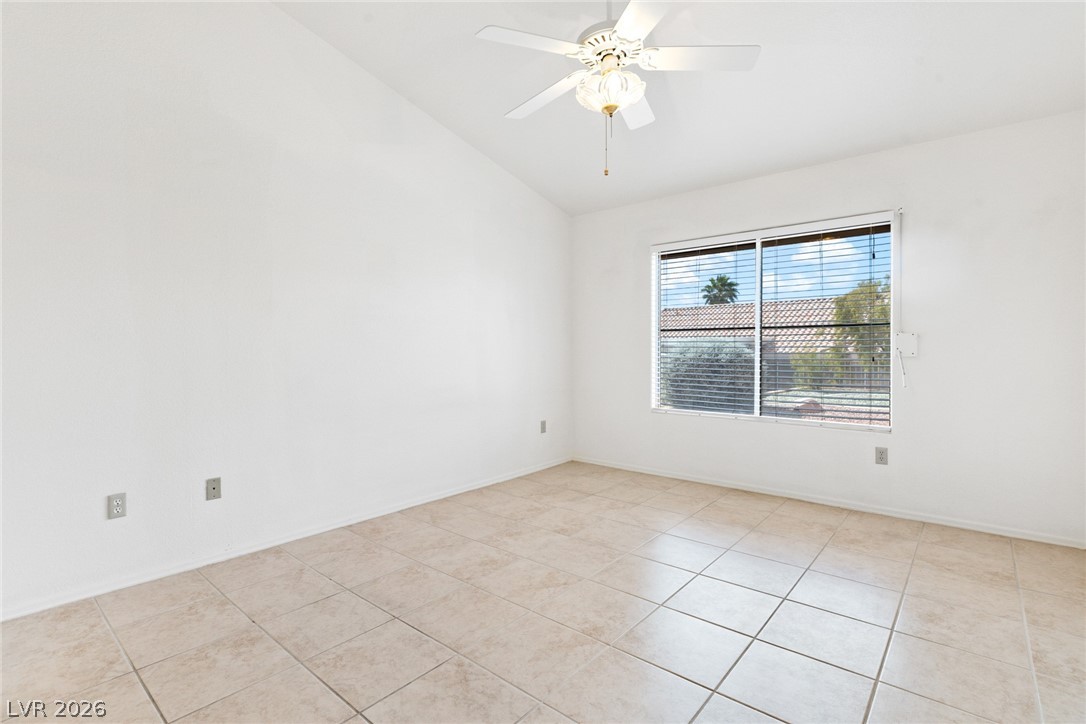 9433 Quail Ridge Drive Las Vegas, NV 89134 - Photo 20 of 25 This bright room features tile flooring and a window with outdoor views, perfect for comfortable living.