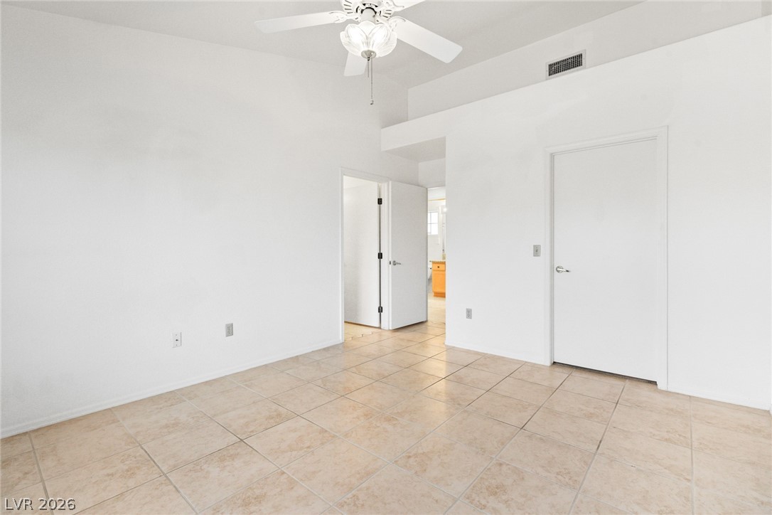 9433 Quail Ridge Drive Las Vegas, NV 89134 - Photo 21 of 25 Bright and airy room with clean lines and tiled flooring offers a versatile space.