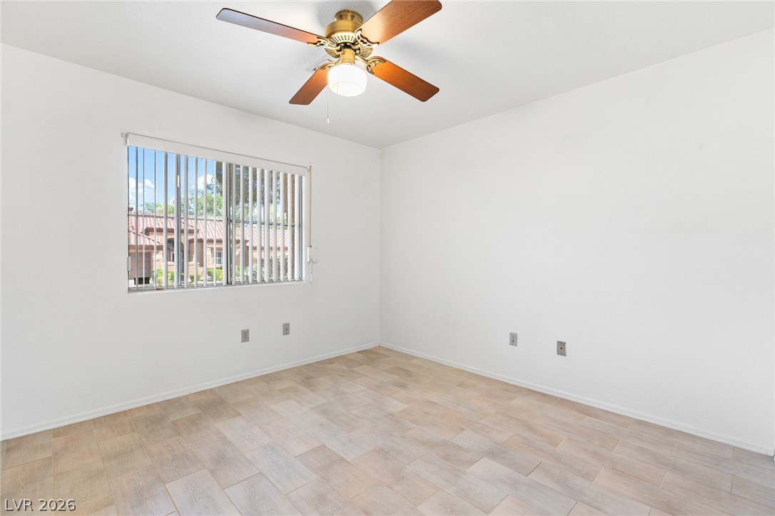 9433 Quail Ridge Drive Las Vegas, NV 89134 - Photo 22 of 25 Bright and airy bedroom with abundant natural light and a practical ceiling fan for comfort.