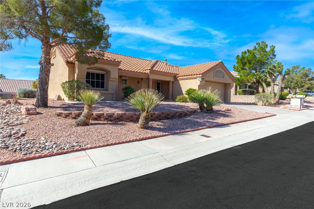 9433 Quail Ridge Drive Las Vegas, NV 89134 - Photo 3 of 25 This charming home offers classic curb appeal and a two-car garage.