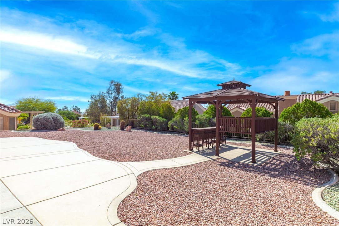 9433 Quail Ridge Drive Las Vegas, NV 89134 - Photo 4 of 25 This spacious yard offers a perfect blend of outdoor entertaining and natural beauty.