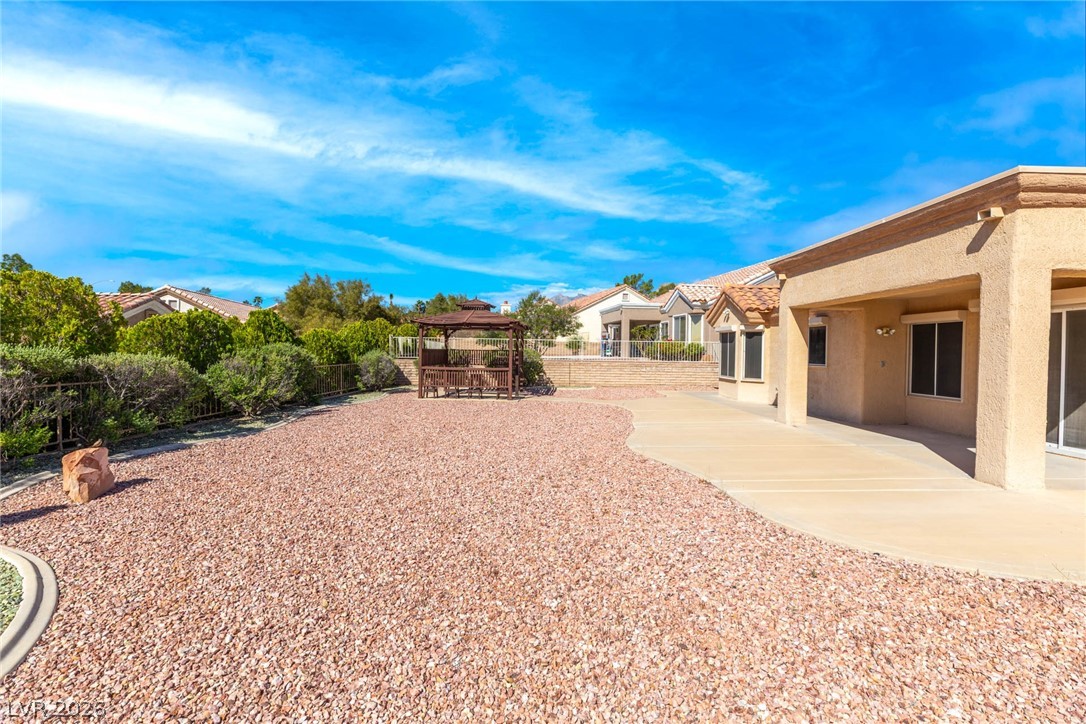 9433 Quail Ridge Drive Las Vegas, NV 89134 - Photo 6 of 25 This spacious backyard features a gazebo and ample patio space for outdoor enjoyment.