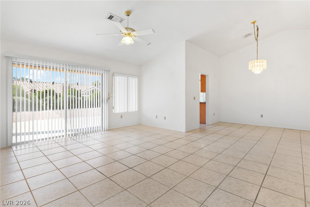 9433 Quail Ridge Drive Las Vegas, NV 89134 - Photo 9 of 25 This bright and airy living area features a clean design with expansive sliding glass doors.
