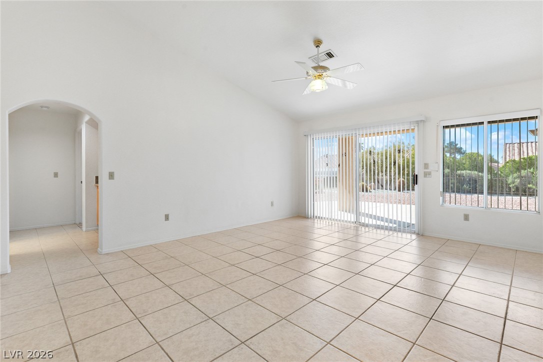 9433 Quail Ridge Drive Las Vegas, NV 89134 - Photo 10 of 25 This living room features vaulted ceilings and tiled floors, complemented by abundant natural light.