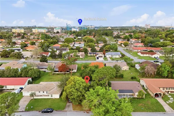 an aerial view of residential houses with outdoor space