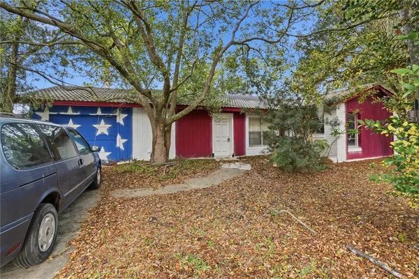 a view of a yard with cars