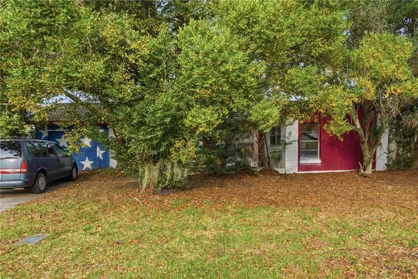 a room with lot of wooden furniture and a chandelier